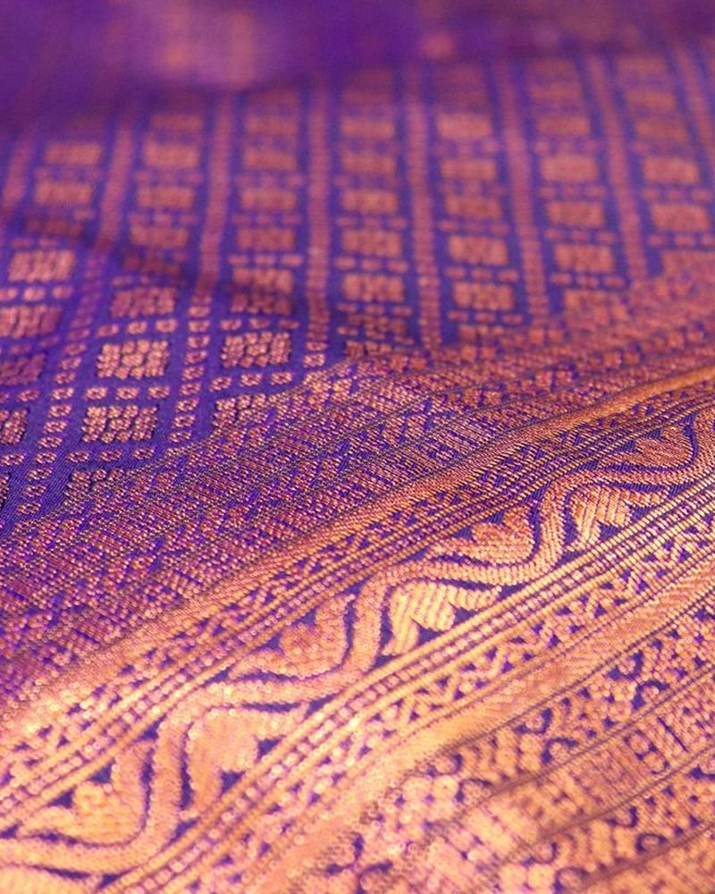Purple silk with a gold woven pattern